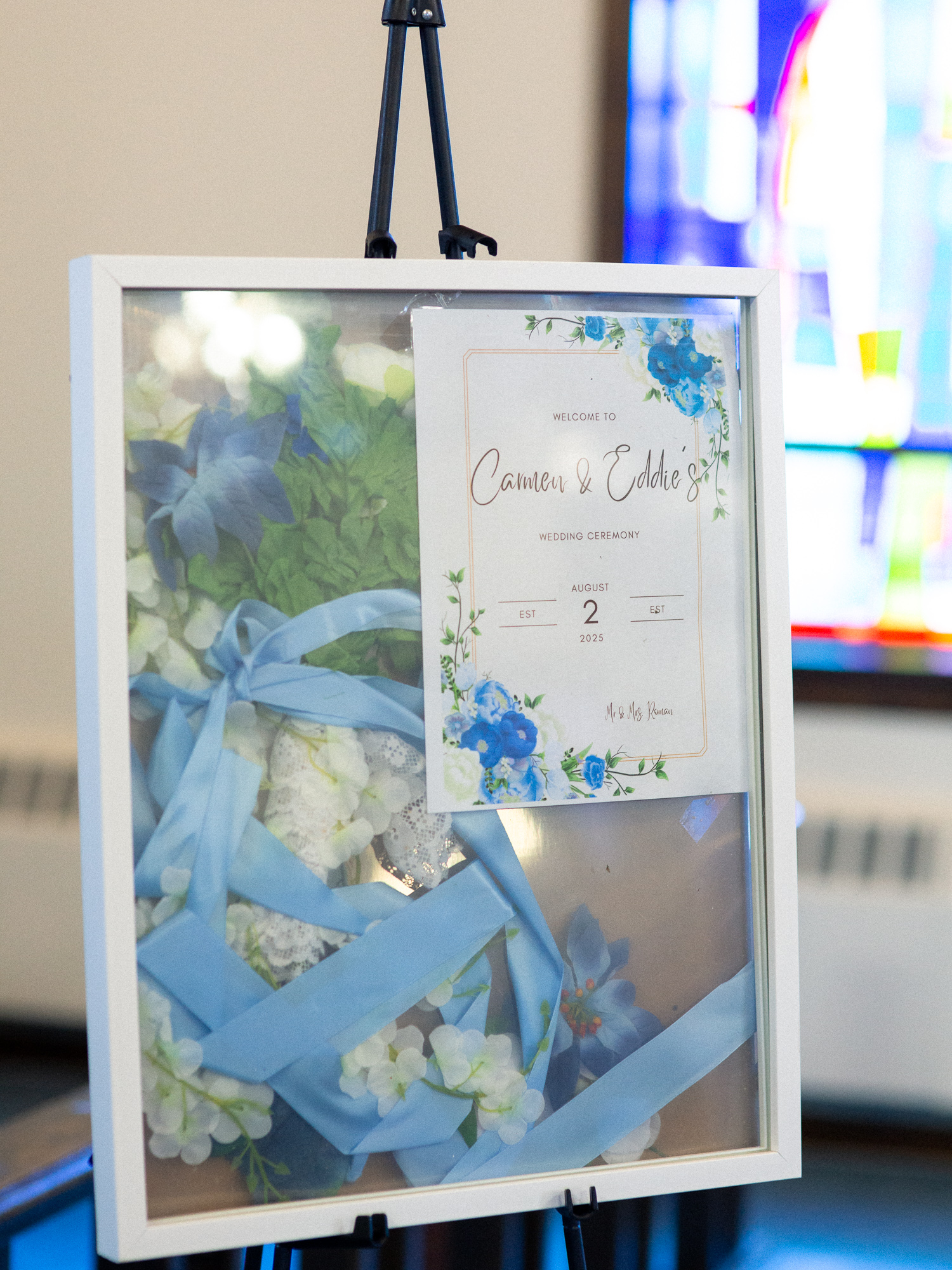 detail of wedding invitation in a frame