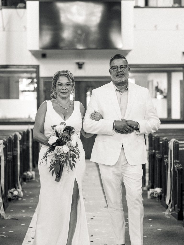 bride and groom walking down the isle