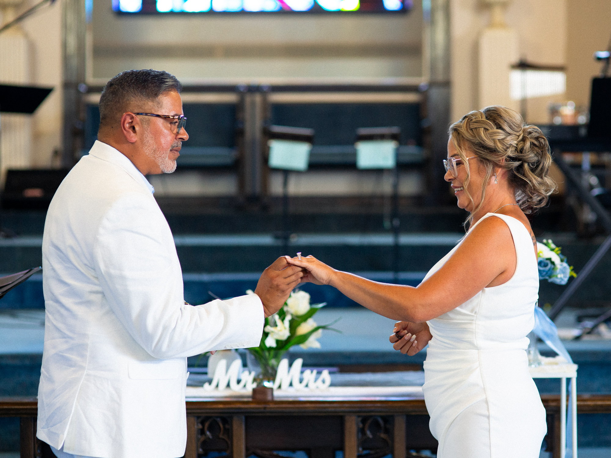 bride and groom exchanging rings