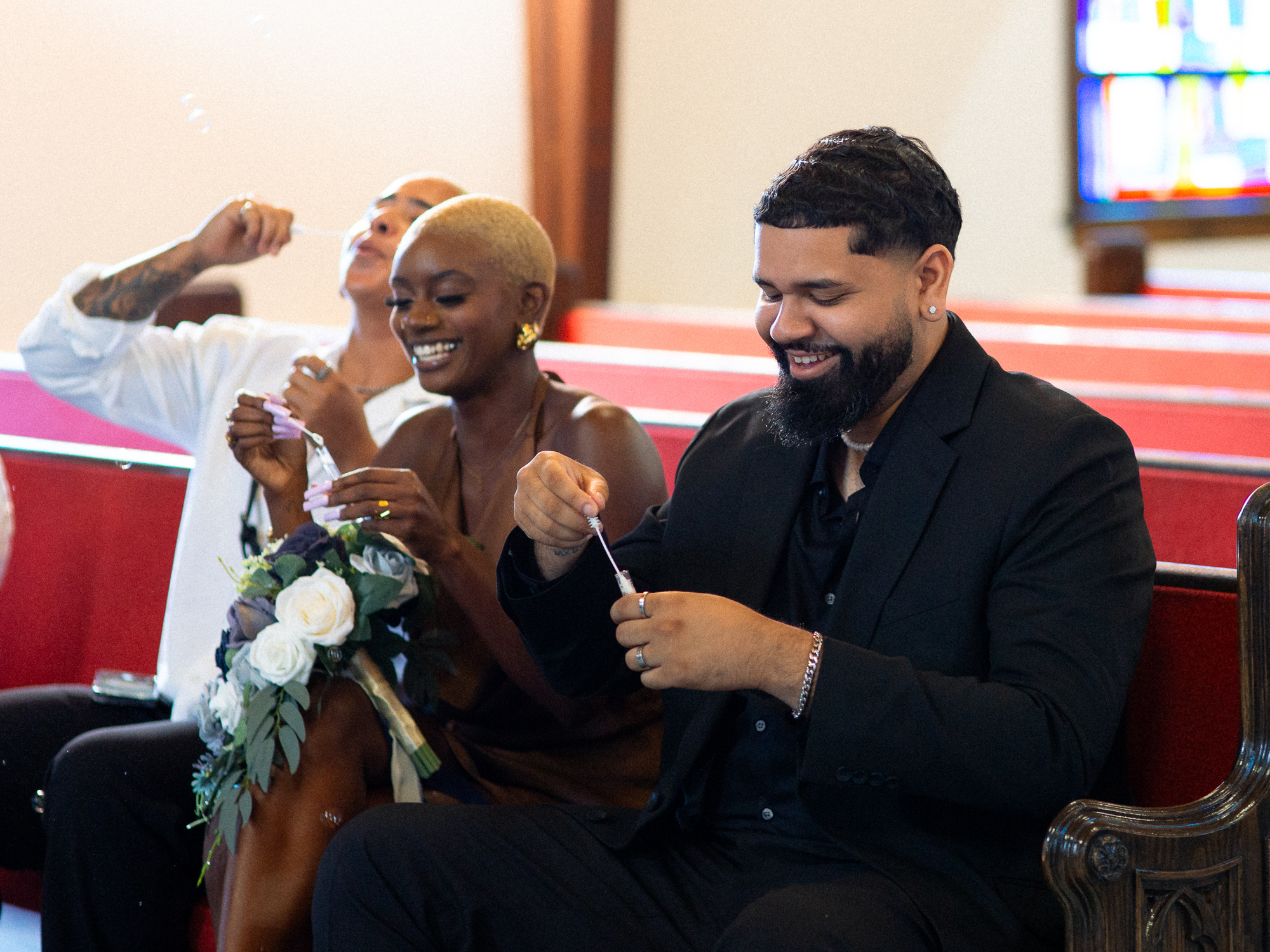guest laughing at a wedding cermeony