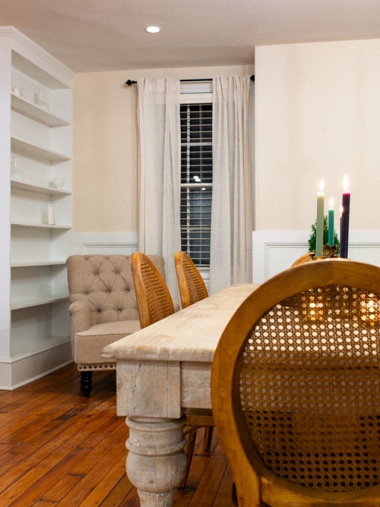 Medium composition of a table, chairs, and book case