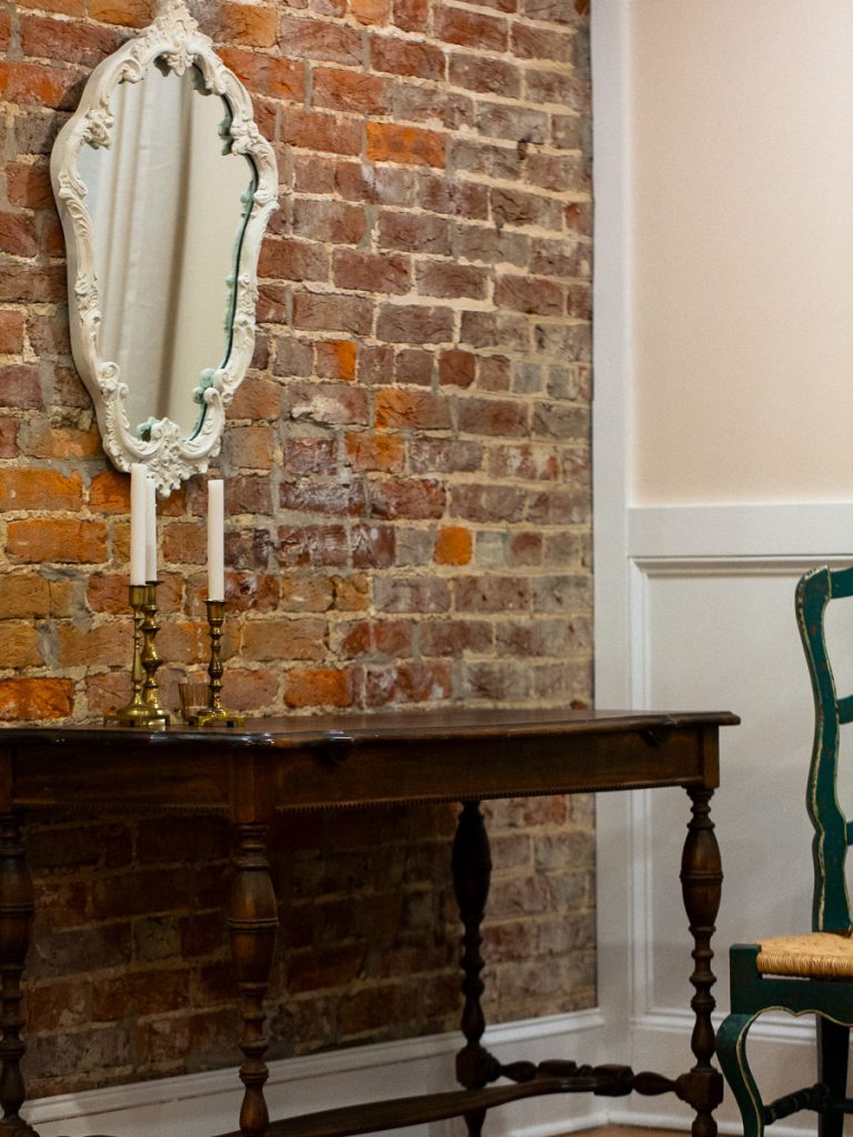 Close up of table, mirror, and chair