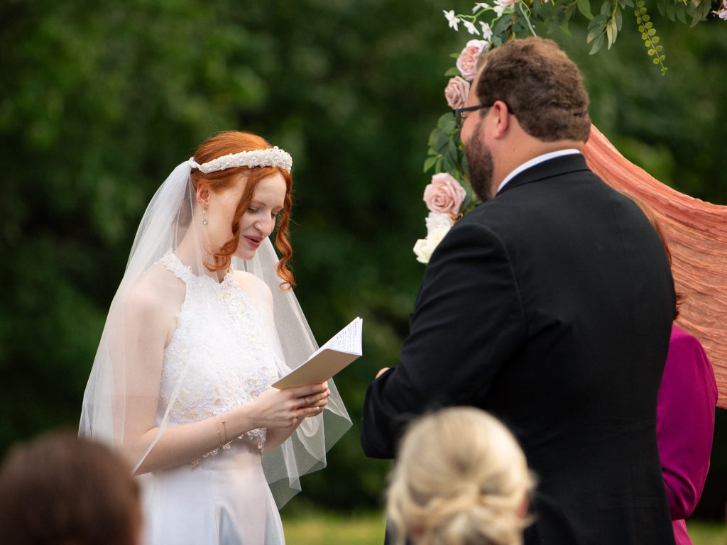 bride and groom exchanging vows