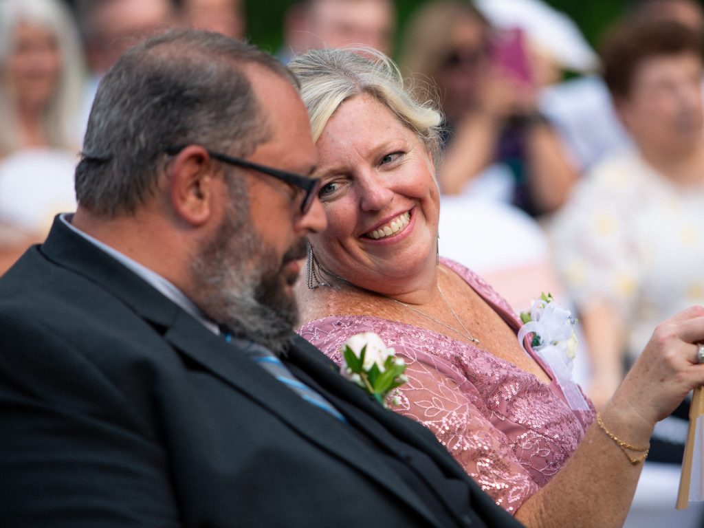 candid photo of groom's parents