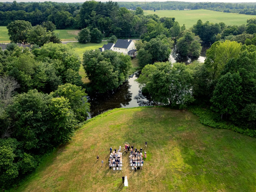 drone photo of bride walking down the isle