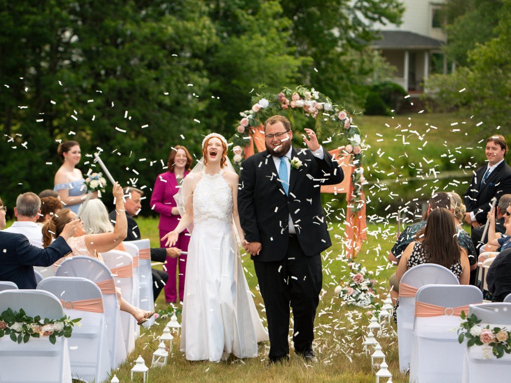 bride and groom walking down the isle after being married