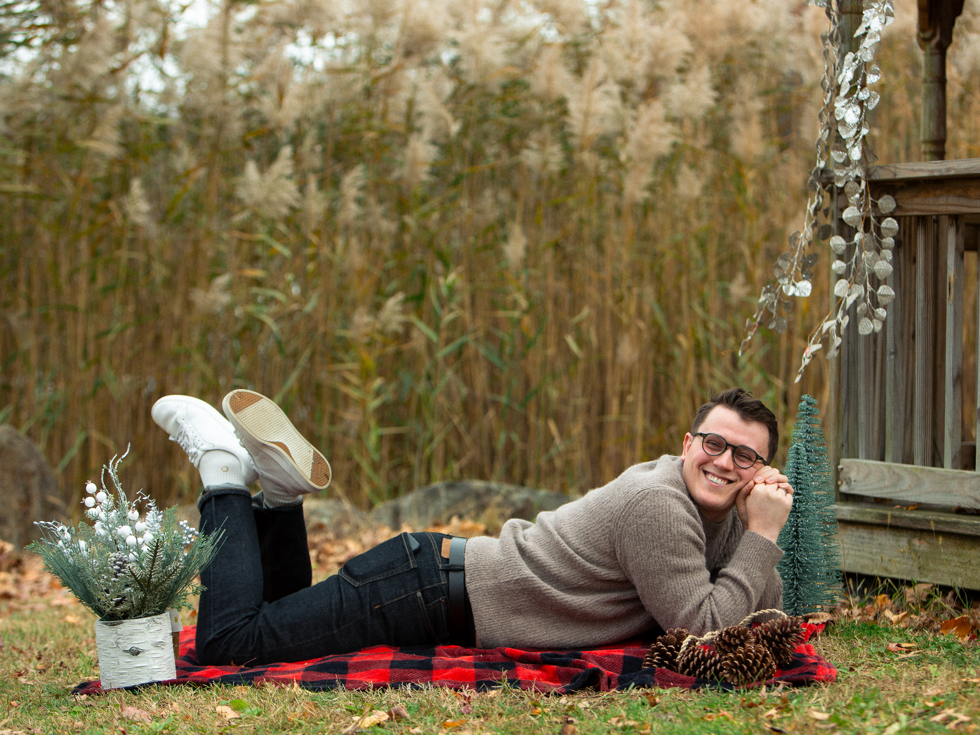 candid of a man laying on a blanket