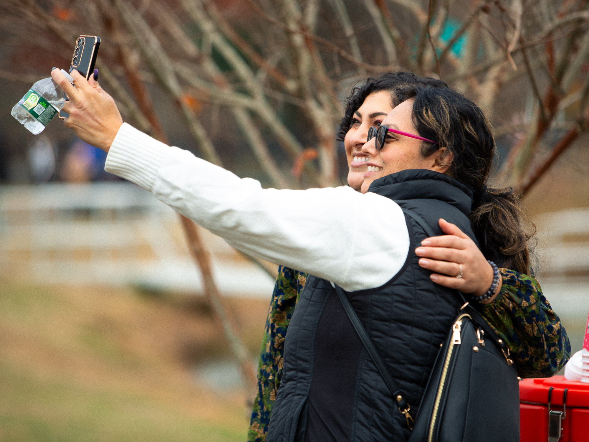 candid of two women taking a selfie