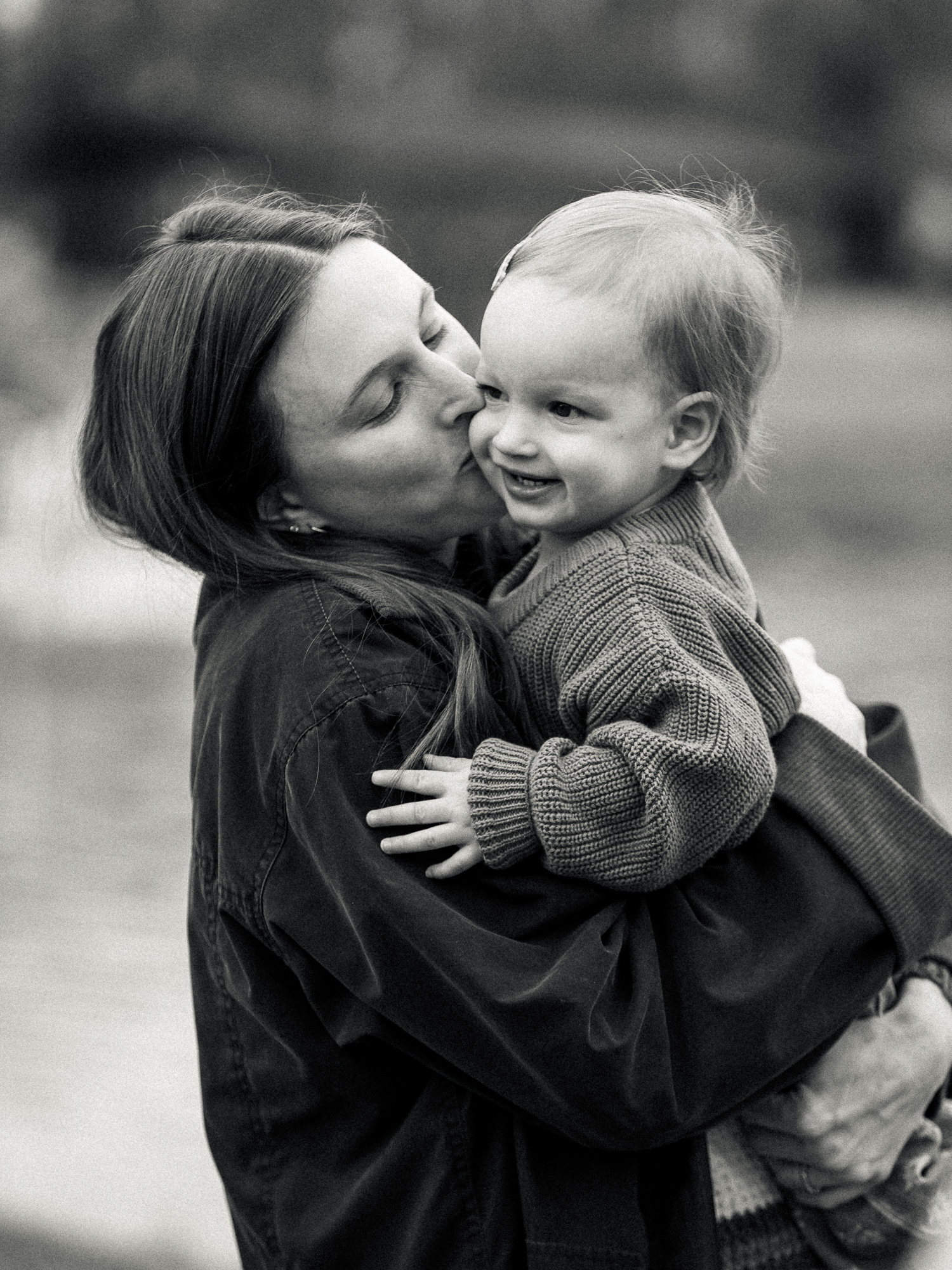 candid photo of mom and daughter